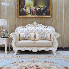 Stylish Rococo white sofa with decorative pillows