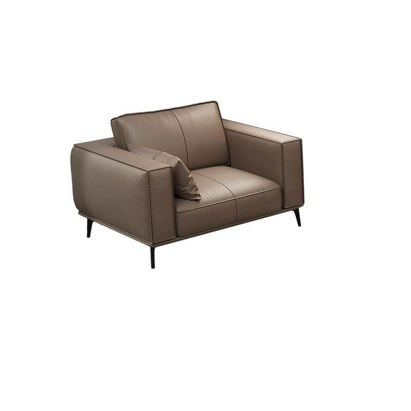 Leather upholstered sofa with pillows