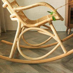 Natural wood legs of the Scandinavian rocking chair