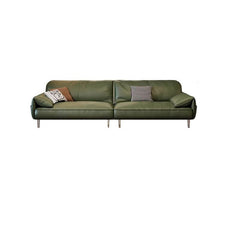 Three decorative pillows on olive green couch