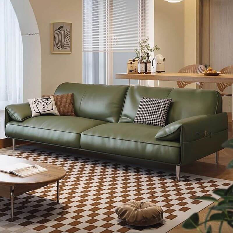 Comfortable pillow back on olive green sofa Main image