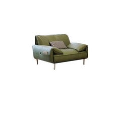 Three decorative pillows on olive green couch