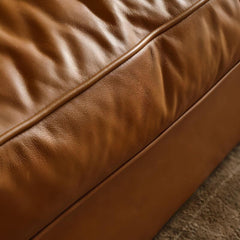 Plush cushions and armrest design of the sofa