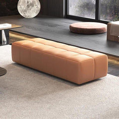 Modern beige upholstered bench with decorative stitching