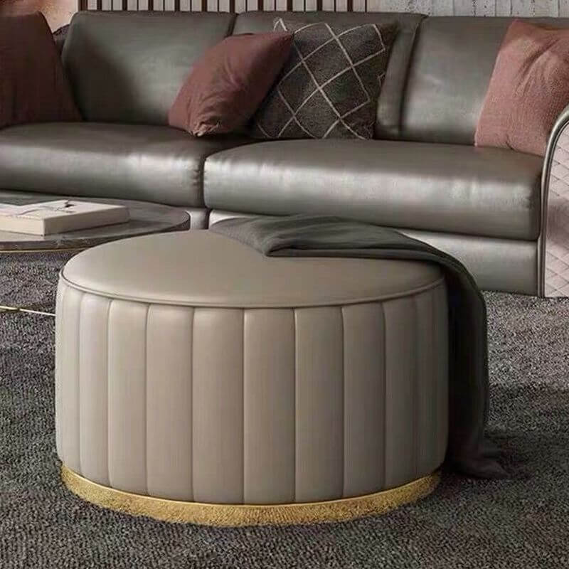 Modern dark gray upholstered stool on wheels