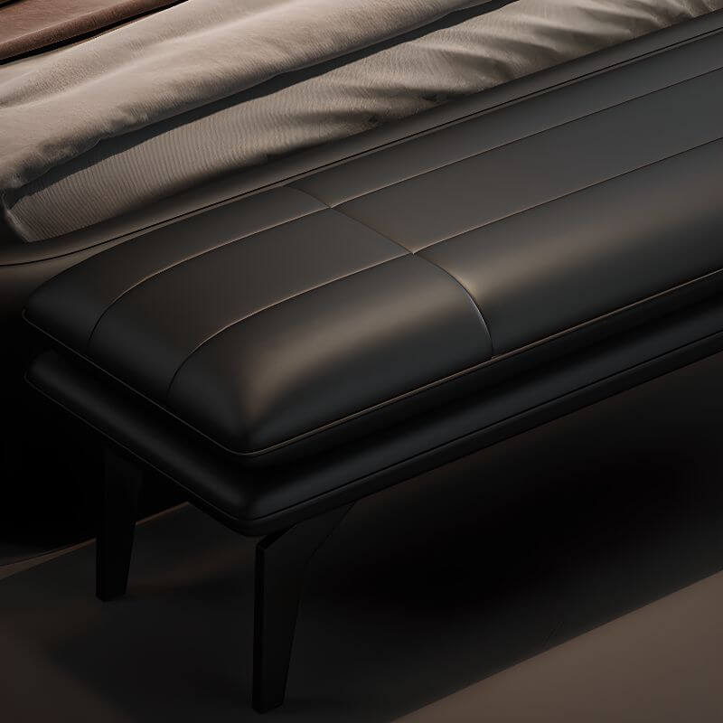 Long upholstered bench chair stylishly placed at the foot of the bed