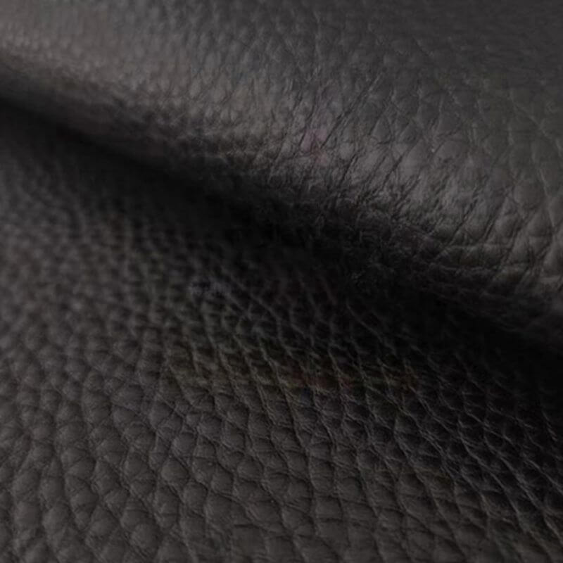 Stylish black sofa with plush cushions