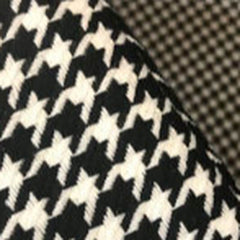 Armrest detail of houndstooth chair