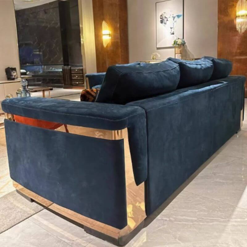 Plush dark blue sofa in interior setting