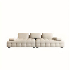 Modern sofa with three decorative pillows in a living room setting