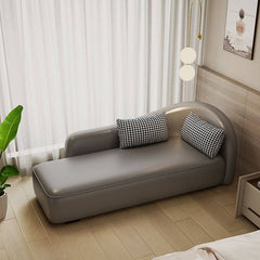 Gray modern chaise lounge with pillow