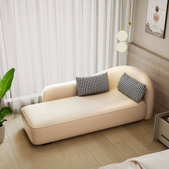 White and orange chaise lounge in modern decor