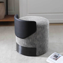 Versatile upholstery accent stool on wooden floor