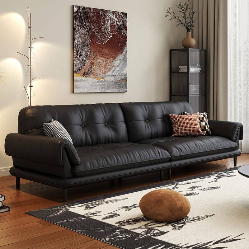 minimalist living room with black sofa