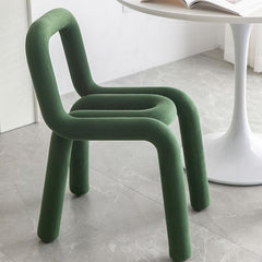 Side view of yellow accent stool demonstrating elegant curves