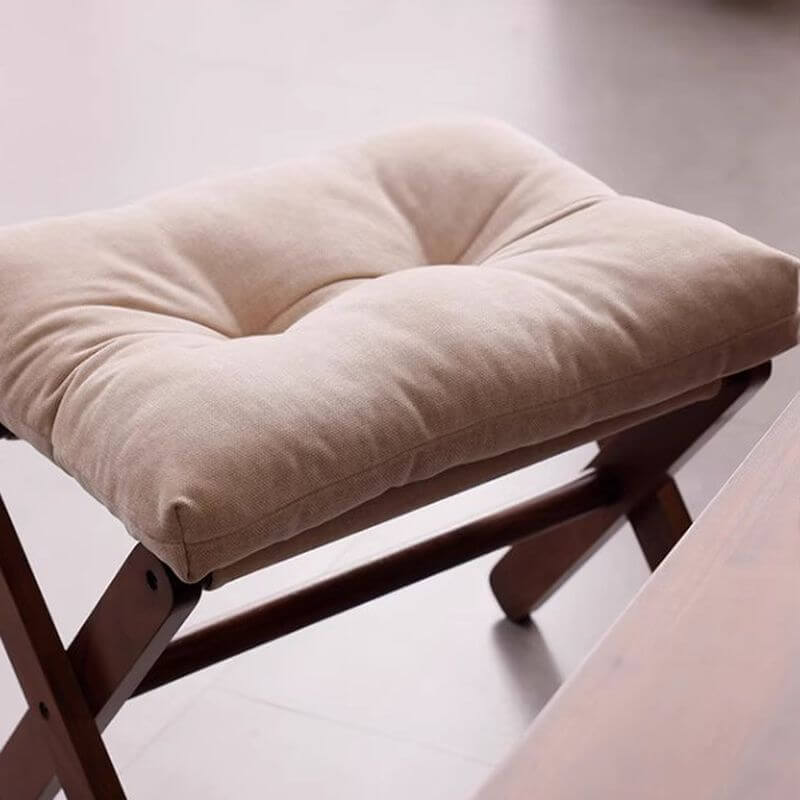 Compact ivory ottoman for small spaces