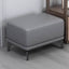 Brown rectangular footstool with black legs