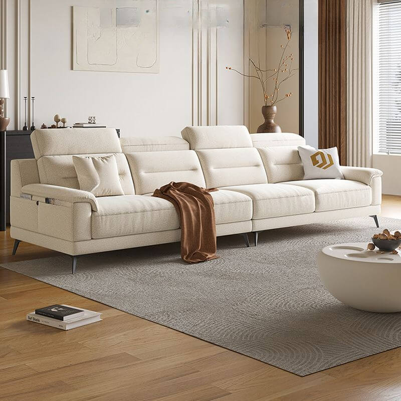A luxurious off-white high backrest sofa with wide pillow back and plush cushions in a modern living room setting.