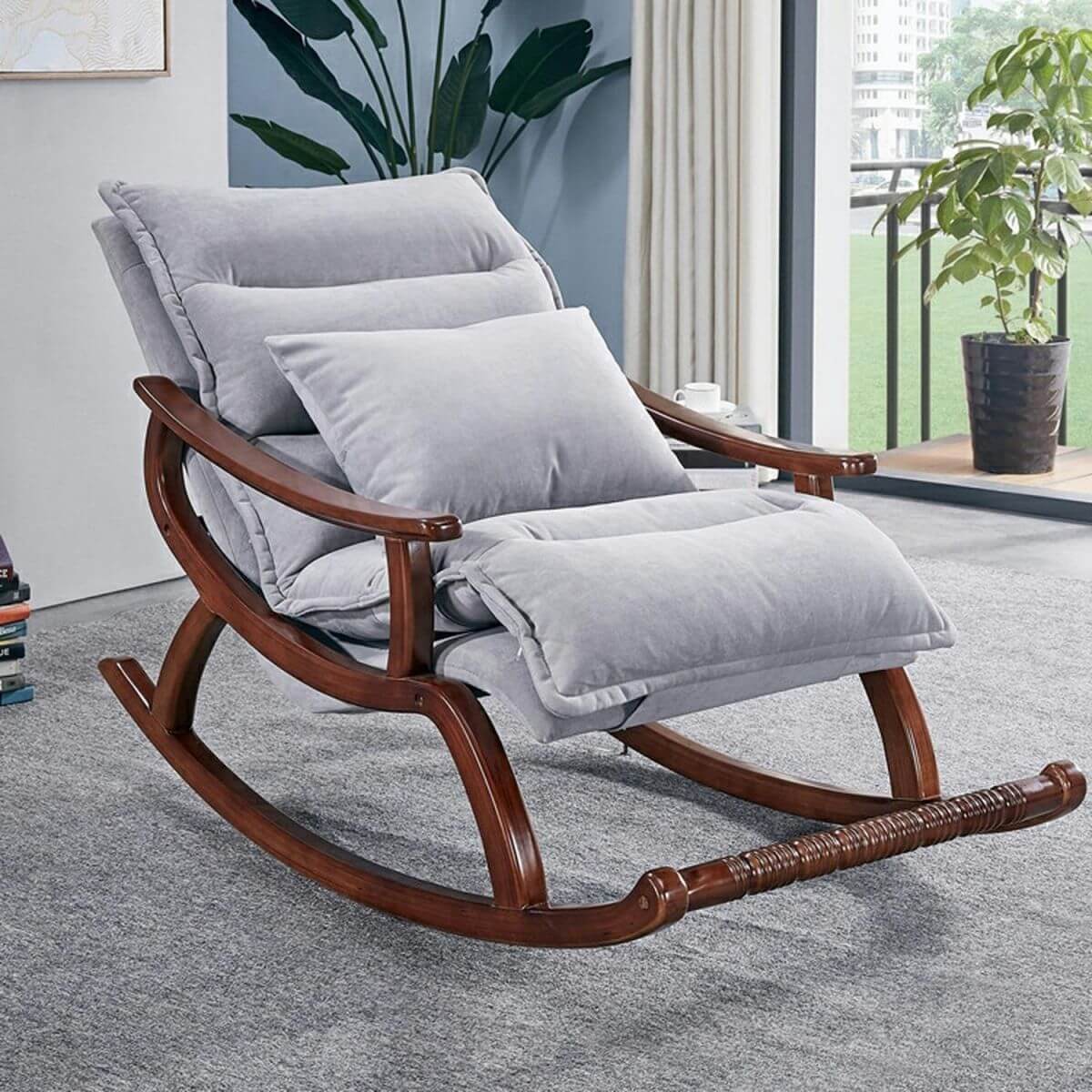 Stylish modern upholstered rocking chair in grey color