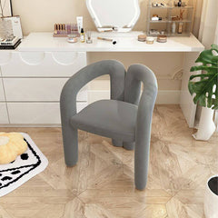 Upholstered vanity stool in yellow for beauty routines