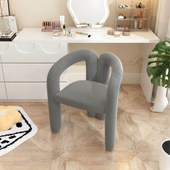 Upholstered vanity stool in yellow for beauty routines