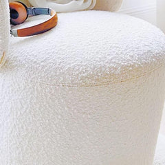 Close-up of beige upholstery on a vanity stool