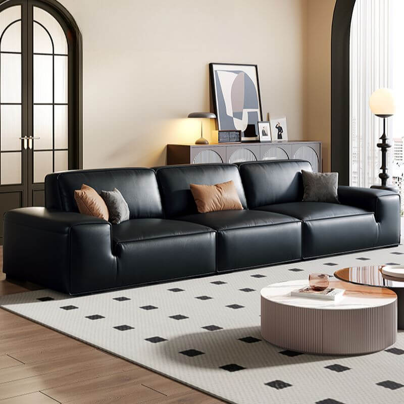 Elegant black sofa couch with plush cushions