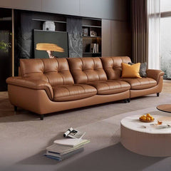 Mocha colored sofa with decorative pillows