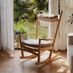 Traditional wood rocking chair with rope back