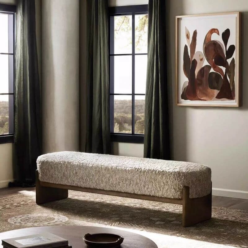 Trendy ivory upholstered bench in modern living room