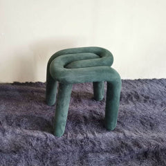 Green Upholstered Accent Stool on White Background