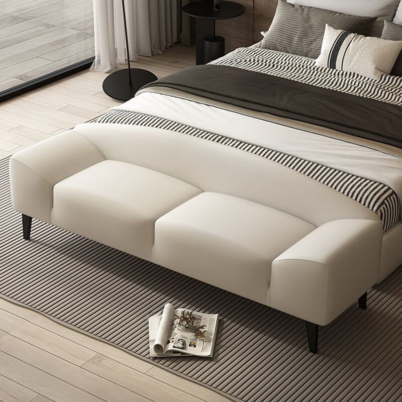 Grey upholstered accent bench in modern living room