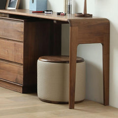 Upholstered brown vanity stool with wood frame