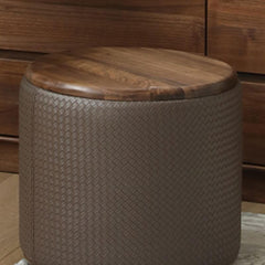 Versatile brown stool placed under a table