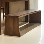 Close-up of the grain pattern on the wooden surface of the dining bench