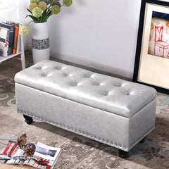 Butter colored upholstered ottoman with legs