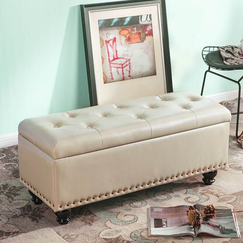 Green storage ottoman with nailhead trim