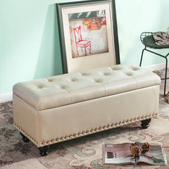 Green storage ottoman with nailhead trim