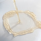 Close up of nailhead trim on storage ottoman