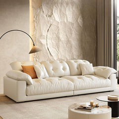 Modern white sofa with pillows