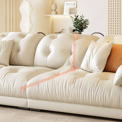 White modern sofa with three decorative pillows