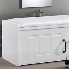 Compact white ottoman in a luxurious bedroom