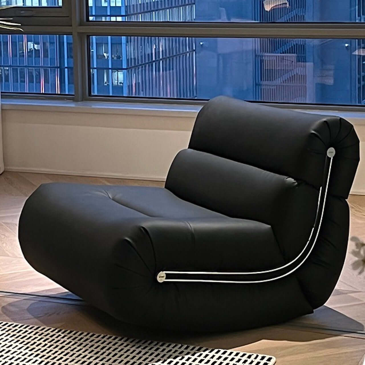 Black synthetic fiber rocking lounge chair with caterpillar design, single sofa seat