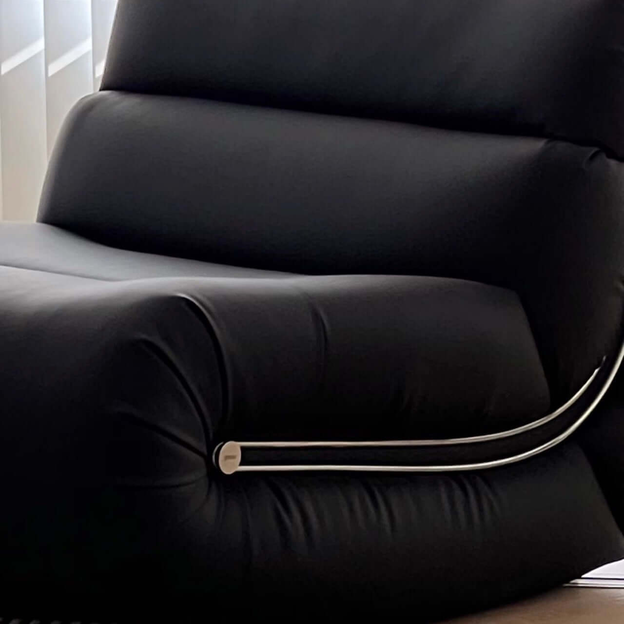 Black synthetic fiber rocking lounge chair with caterpillar design, single sofa seat