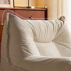 White corduroy single lounge chair with soft recliner design, inspired by Caterpillar Togo sofa