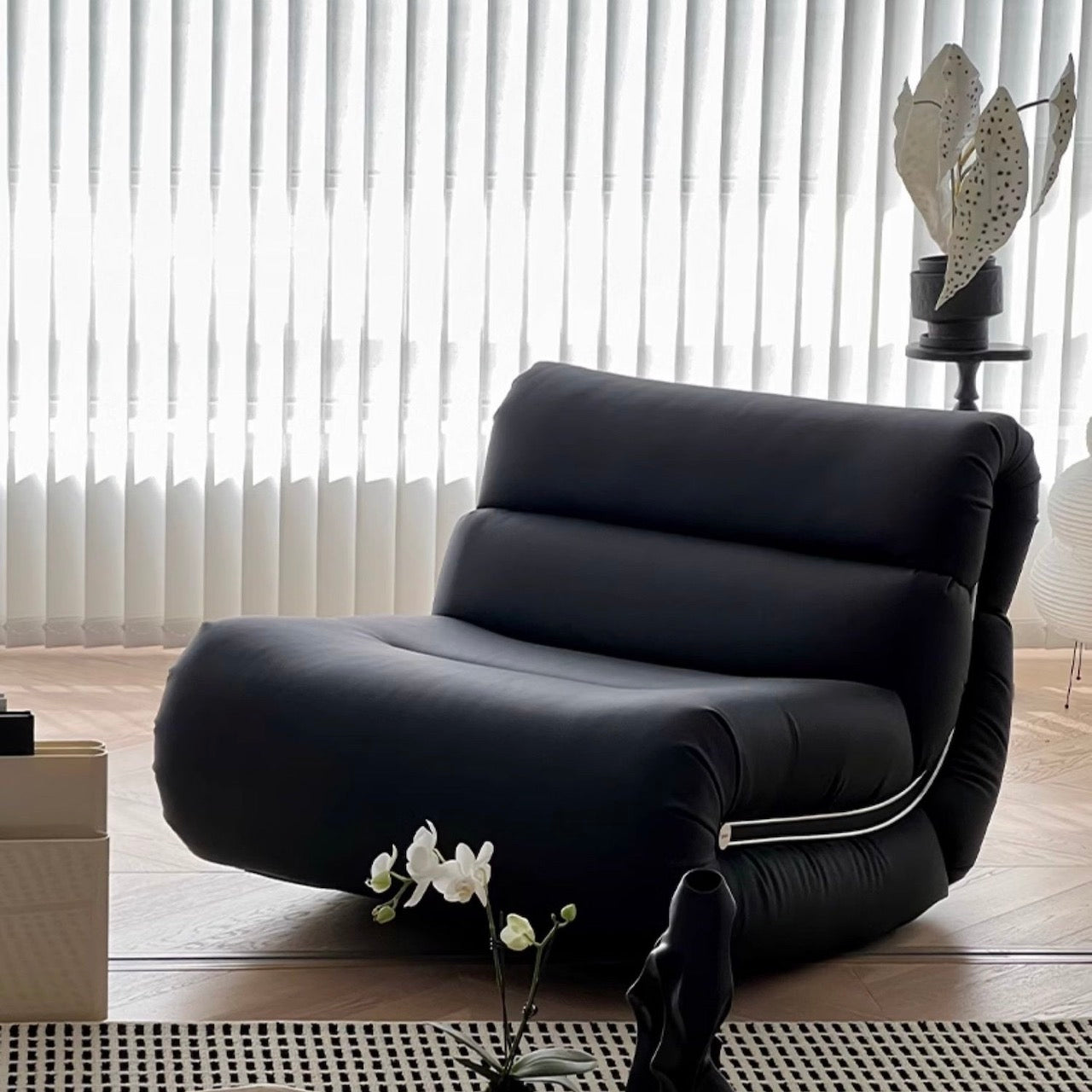Stylish Black Caterpillar Lounge Chair with Rocking Feature