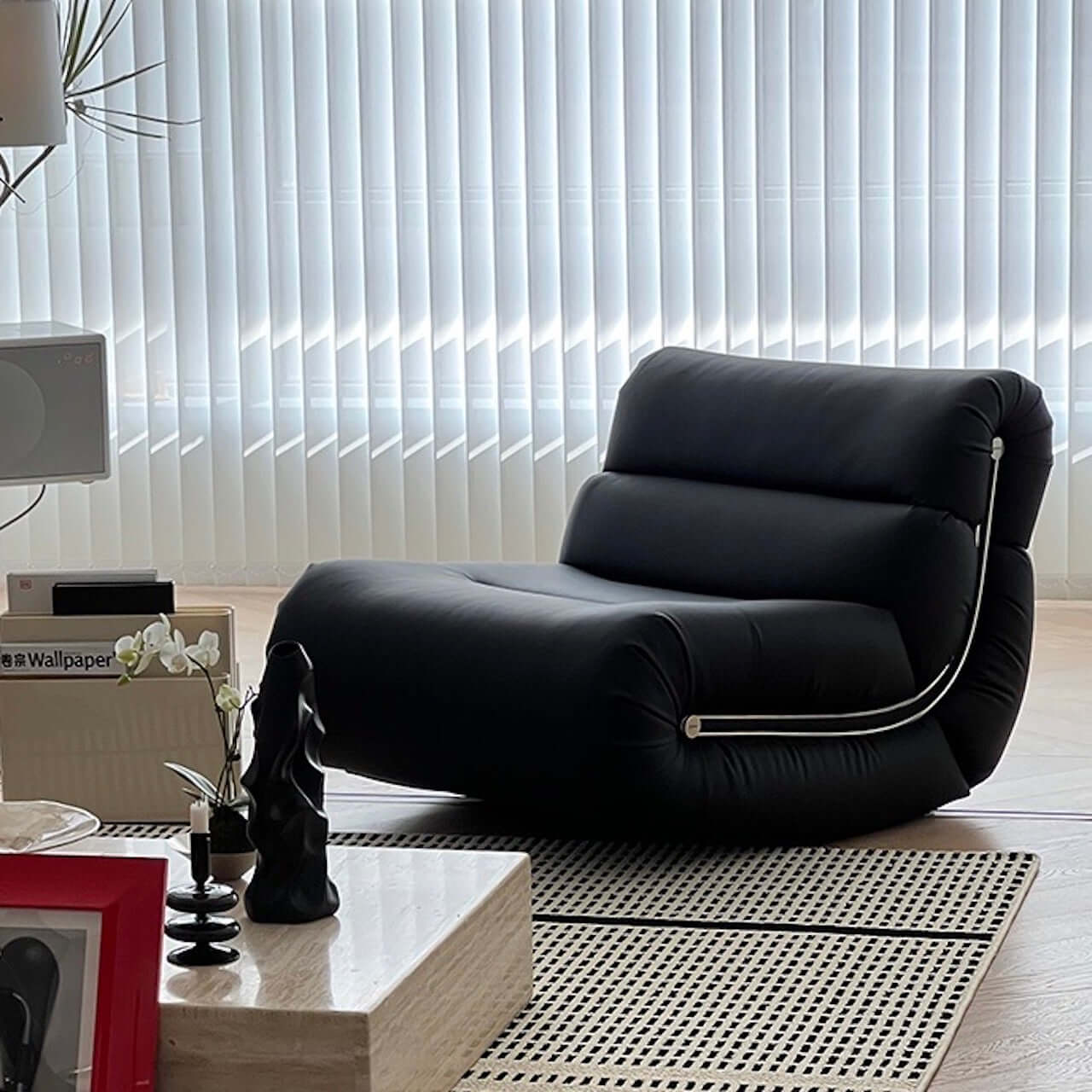 Black synthetic fiber rocking lounge chair with caterpillar design, single sofa seat