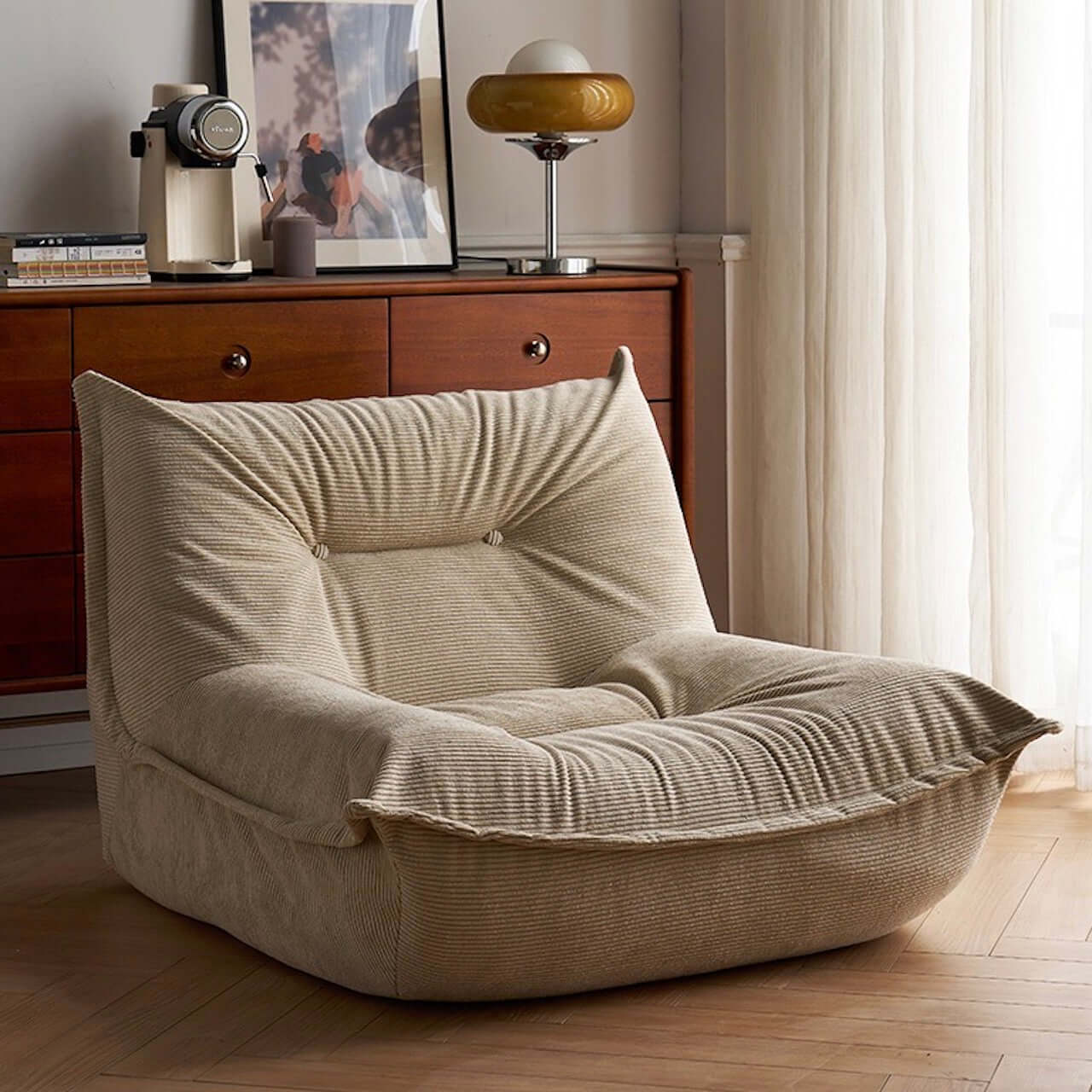 White corduroy single lounge chair with soft recliner design, inspired by Caterpillar Togo sofa