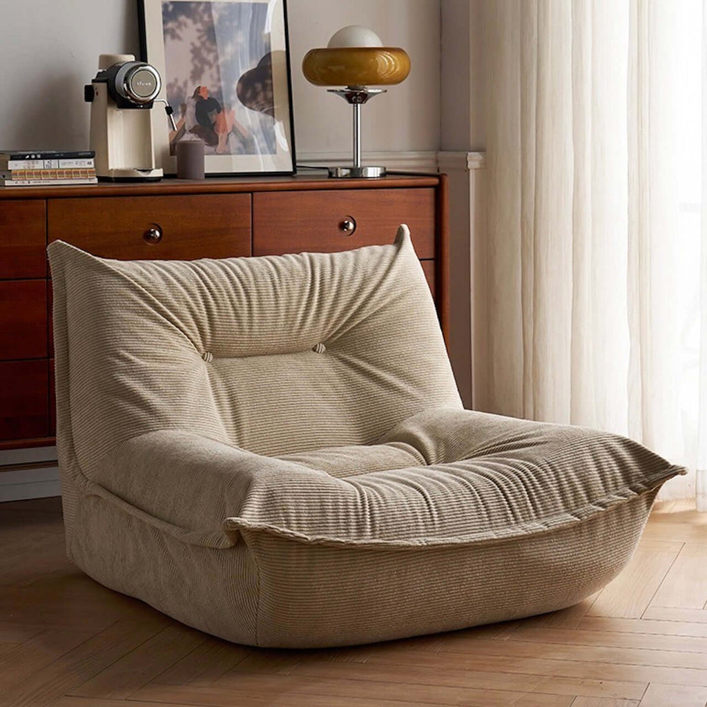White corduroy single lounge chair with soft recliner design, inspired by Caterpillar Togo sofa