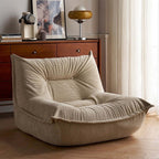 White corduroy single lounge chair with soft recliner design, inspired by Caterpillar Togo sofa